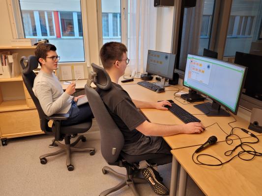 Two exchange students from Stuttgart Germany in the control room of the usability lab